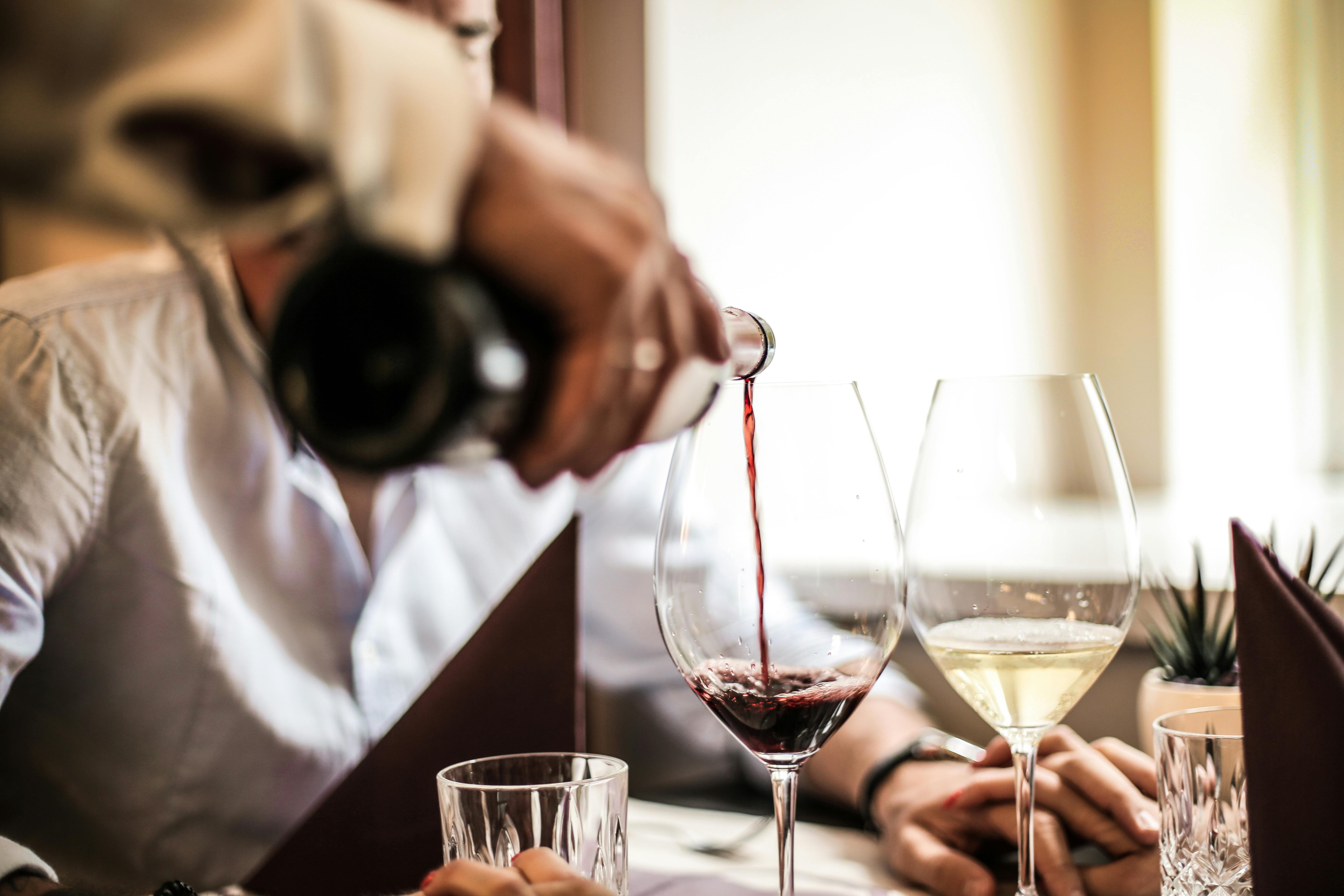 waiter serving wine